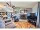 Bright living room features a vaulted ceiling, fireplace, and seamless flow to the dining area at 7716 Shenandoah Dr, Elizabeth, CO 80107