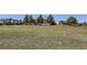 Expansive property with a large grassy field, a two-story home, and multiple outbuildings at 7716 Shenandoah Dr, Elizabeth, CO 80107