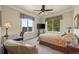 Comfortable bedroom with two large windows providing lots of natural light, and a work space at 2378 Plumb Pl, Erie, CO 80516