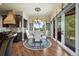Charming dining area featuring a round table, elegant rug, and sliding doors to a balcony with outdoor views at 2378 Plumb Pl, Erie, CO 80516