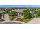 Expansive home exterior featuring professional landscaping and a circular driveway at 2378 Plumb Pl, Erie, CO 80516