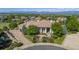 Expansive home exterior featuring professional landscaping, a circular driveway, and mountain views at 2378 Plumb Pl, Erie, CO 80516