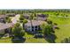 Rear exterior view of a luxury home with a covered patio, lawn, and professional landscaping at 2378 Plumb Pl, Erie, CO 80516