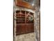 Well-stocked wine cellar featuring wooden shelves and stone accents for a rustic feel at 2378 Plumb Pl, Erie, CO 80516