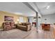Spacious basement living area with sofas, games, and recessed lighting at 6979 Weasel Way, Evergreen, CO 80439