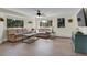 Bright and airy living room featuring plush seating, mountain views, and ample natural light at 6979 Weasel Way, Evergreen, CO 80439