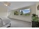 Bedroom featuring large windows with great views of nature at 6979 Weasel Way, Evergreen, CO 80439