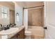 Well-lit bathroom showcases a granite countertop vanity and tiled shower/tub combo, ideal for a modern aesthetic at 10631 Autumnsong Ct, Highlands Ranch, CO 80126