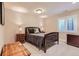 Well-lit bedroom with plush carpet, shuttered windows, and a decorative chest for added charm at 10631 Autumnsong Ct, Highlands Ranch, CO 80126