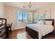 Bright bedroom boasts hardwood floors, a desk, and shuttered windows with mountain views at 10631 Autumnsong Ct, Highlands Ranch, CO 80126