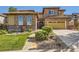Charming home with stone accents, lush lawn and beautifully landscaped front yard at 10631 Autumnsong Ct, Highlands Ranch, CO 80126
