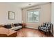 Office space with hardwood floors, large window with blinds, and comfortable furnishings at 10631 Autumnsong Ct, Highlands Ranch, CO 80126