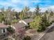 An aerial view shows the home and its mature, lush landscaping at 683 Sunnyside St, Louisville, CO 80027