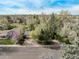 This aerial image shows the home nestled among lush trees and landscaping at 683 Sunnyside St, Louisville, CO 80027