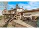 Backyard featuring a deck, patio area, steps to the second floor, and a well-maintained yard at 683 Sunnyside St, Louisville, CO 80027