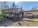 Backyard featuring a deck, patio area, steps to the second floor, and a well-maintained yard at 683 Sunnyside St, Louisville, CO 80027