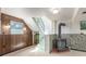 Cozy basement featuring wood paneled walls, a vintage stove, and stairs leading to the upper level at 683 Sunnyside St, Louisville, CO 80027