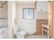 Bathroom with white tiling, showing unfinished renovations and areas needing repair at 683 Sunnyside St, Louisville, CO 80027