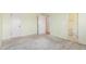 Spacious bedroom featuring neutral walls with carpeted flooring with an adjoining bathroom at 683 Sunnyside St, Louisville, CO 80027