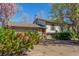 Cozy house with charming details, featuring a two-car garage, mature landscaping, and a warm, inviting entrance at 683 Sunnyside St, Louisville, CO 80027