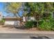 Charming single-Gathering home featuring a two-car garage and well-maintained front yard with mature trees and greenery at 683 Sunnyside St, Louisville, CO 80027