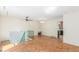Open living area with connecting stairwell to a lower level and adjacent kitchen at 683 Sunnyside St, Louisville, CO 80027
