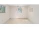 Bright room with light walls, large window, and patterned flooring ready for renovation at 683 Sunnyside St, Louisville, CO 80027