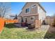 Inviting backyard with patio, outdoor seating, and well-maintained lawn at 16277 Blueleaf Pl, Parker, CO 80134