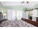 Main bedroom featuring a bed, closet, and barn door leading to an ensuite bathroom at 16277 Blueleaf Pl, Parker, CO 80134