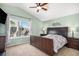 Primary bedroom with a bed, vaulted ceiling, window overlooking the neighborhood at 16277 Blueleaf Pl, Parker, CO 80134