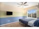 Comfortable bedroom offering a window, ceiling fan, and carpeted floor at 16277 Blueleaf Pl, Parker, CO 80134