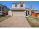 Charming two-story home with a well-maintained lawn and a two-car garage at 16277 Blueleaf Pl, Parker, CO 80134