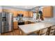 Well-lit kitchen with stainless steel appliances and modern fixtures at 16277 Blueleaf Pl, Parker, CO 80134