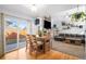 Open floor plan with dining area next to living room and sliding door to backyard at 16277 Blueleaf Pl, Parker, CO 80134