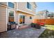 Relaxing patio with outdoor seating, grill, and sliding glass door to the house at 16277 Blueleaf Pl, Parker, CO 80134