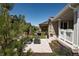 Charming backyard patio with comfortable seating, lush greenery, and well-manicured landscaping at 8102 Adams Fork Ave, Littleton, CO 80125