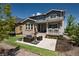 A private backyard featuring a patio, green lawn, and thoughtful landscaping perfect for outdoor living at 8102 Adams Fork Ave, Littleton, CO 80125