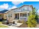 Beautiful two-story home featuring a patio, landscaped yard and brick accents at 8102 S Adams Fork Ave, Littleton, CO 80125