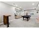 Spacious finished basement with a pool table, bar, and comfortable seating area at 8102 S Adams Fork Ave, Littleton, CO 80125