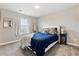 Cozy bedroom featuring a comfortable bed with stylish bedding and matching nightstands with lamps at 8102 S Adams Fork Ave, Littleton, CO 80125