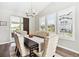 Dining room featuring contemporary lighting and view to the outdoor patio at 8102 S Adams Fork Ave, Littleton, CO 80125