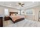 Serene main bedroom boasts tray ceilings, and natural light at 8102 S Adams Fork Ave, Littleton, CO 80125