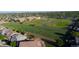 An aerial shot captures the property's proximity to a nearby school and a well-maintained sports field at 12652 Glencoe St, Thornton, CO 80241
