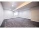 Finished basement space with recessed lighting and a large window at 12652 Glencoe St, Thornton, CO 80241
