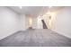 Large finished basement area with stairs to the upper level at 12652 Glencoe St, Thornton, CO 80241