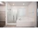 Bathroom featuring a shower and bathtub at 12652 Glencoe St, Thornton, CO 80241