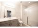 A stylish bathroom features a vanity sink, toilet, and glass-enclosed shower for a spa-like experience at 12652 Glencoe St, Thornton, CO 80241