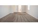 Spacious bedroom with neutral carpet and access to the bathroom with walk-in closet at 12652 Glencoe St, Thornton, CO 80241