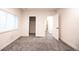 Bedroom with new carpet has a window and 2 open doorways at 12652 Glencoe St, Thornton, CO 80241