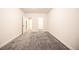 A bright bedroom with gray carpet and ensuite closet provides a peaceful retreat at 12652 Glencoe St, Thornton, CO 80241
